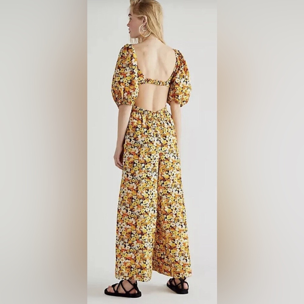 Free People orange yellow white black floral jumpsuit size L with cute open back